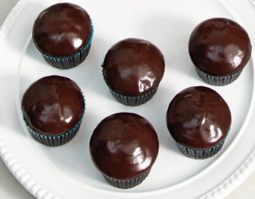 These super-chocolaty cupcakes are crowned with a delicious chocolate glaze Super Chocolaty Cupcakes